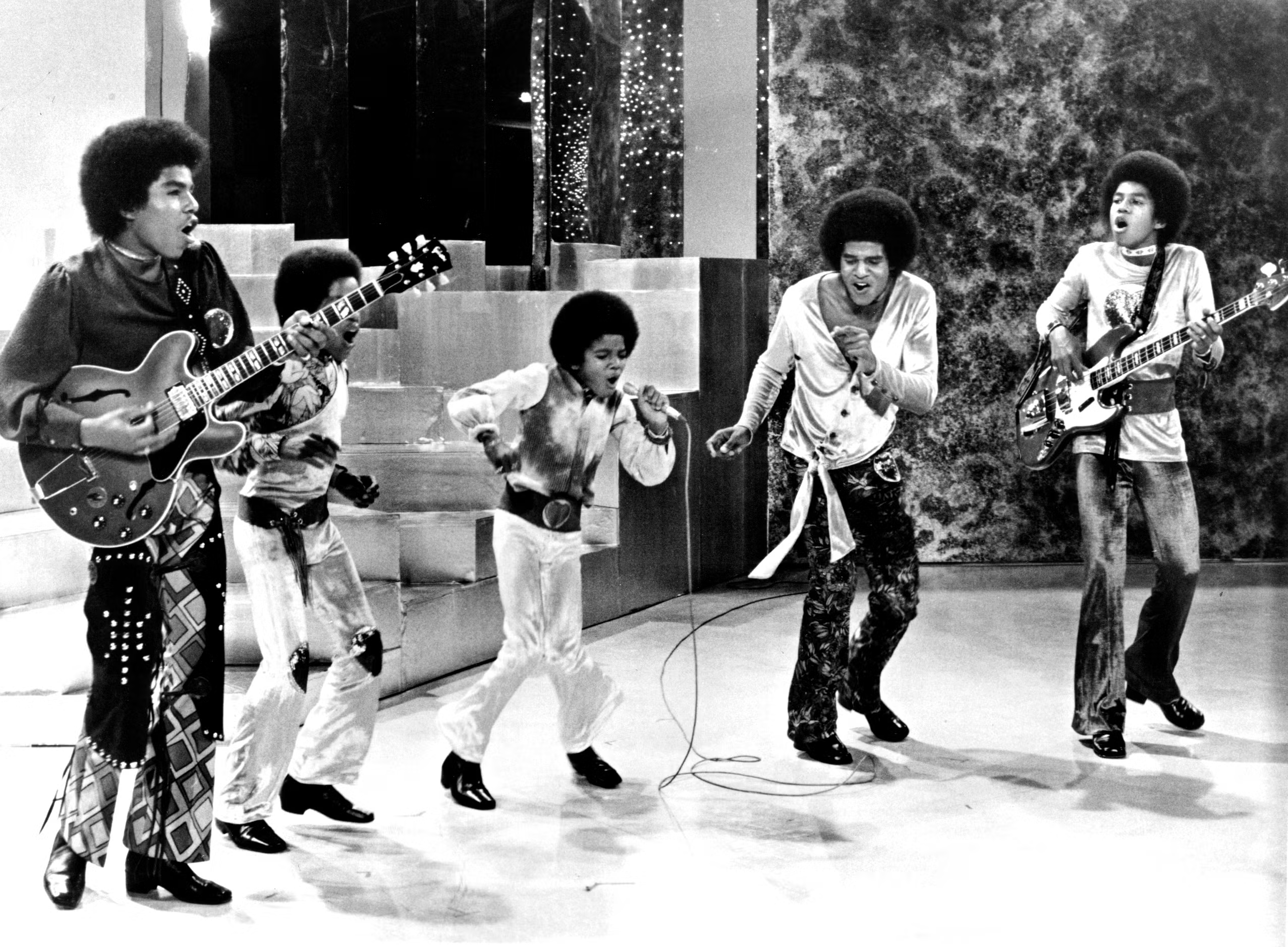 The Jackson 5, seen performing around 1969, included brothers Tito Jackson, Marlon Jackson, Michael Jackson, Jackie Jackson, and Jermaine Jackson
